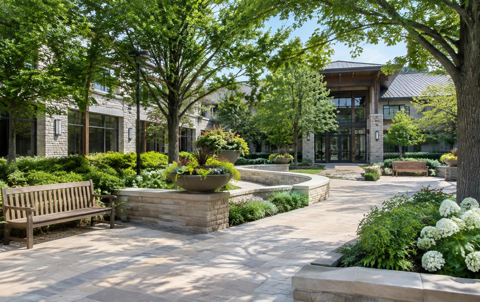 Landscaped commercial courtyard with stone walkways and planters (illustrative image)